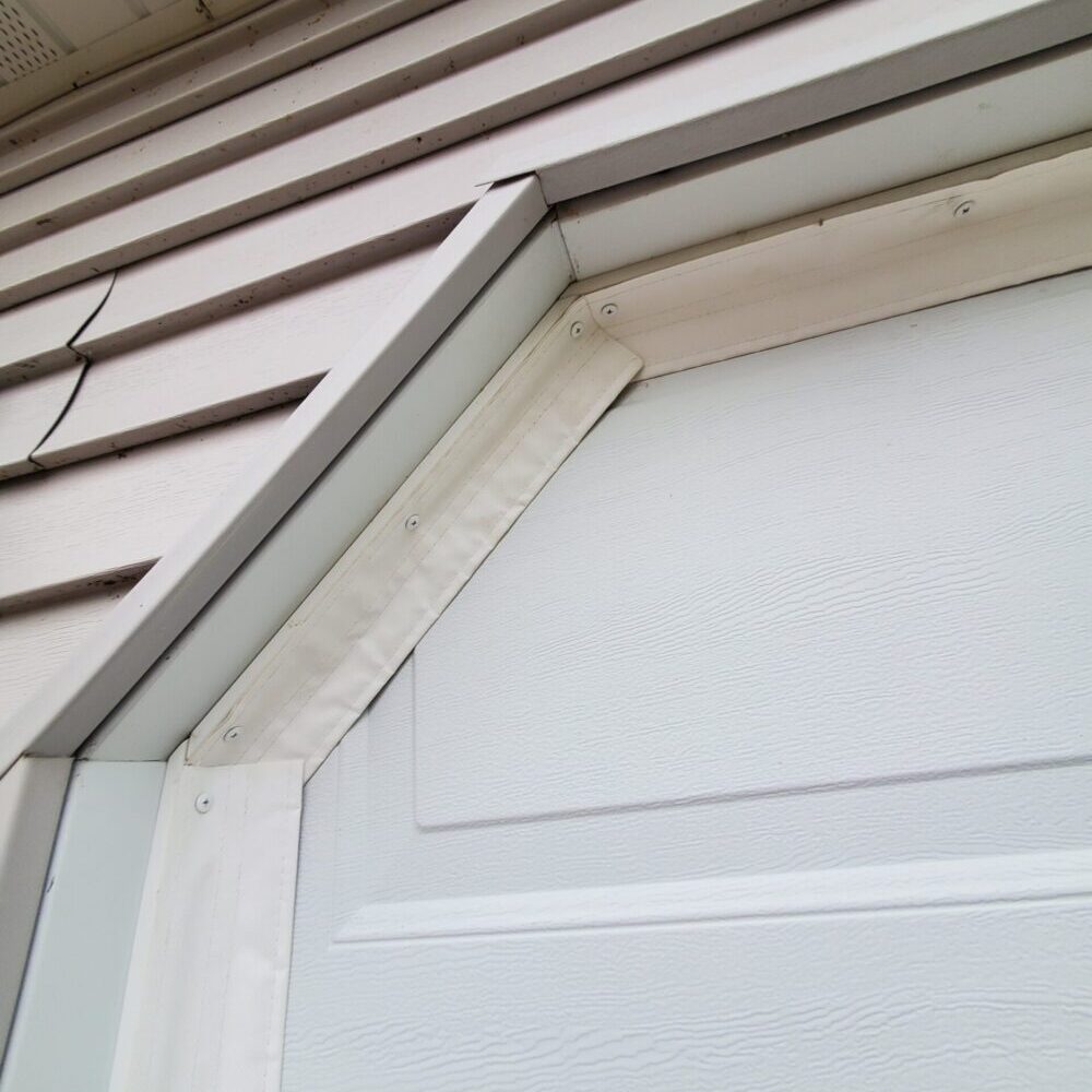 SnirtStopper SideSealer garage door seal installed on an angled corner