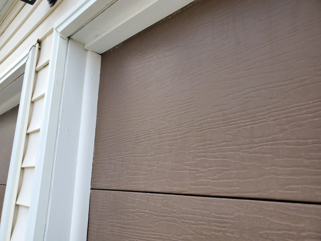 Garage door shown before Side/TopSealer installation
