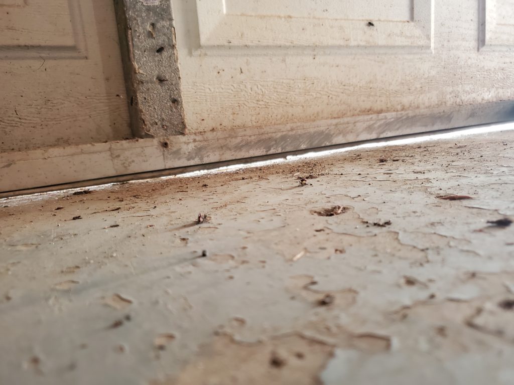 Garage door shown before BottomSealer installed