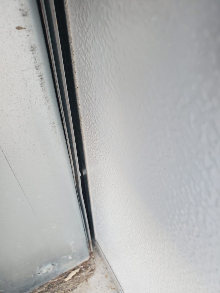 Garage door shown before Side/TopSealer installation