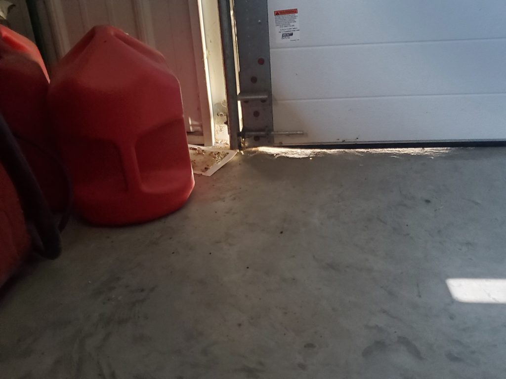 Garage door shown before BottomSealer installed