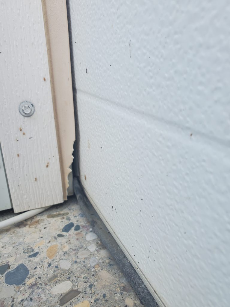 Garage door shown before Side/TopSealer installation