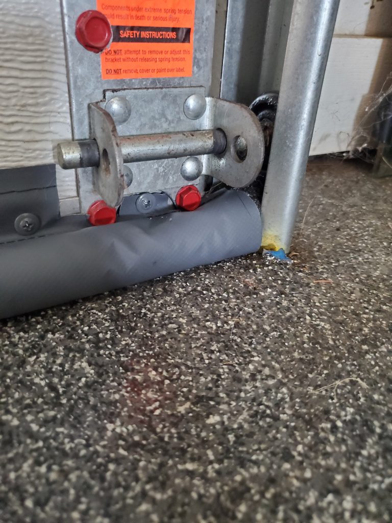 Garage door shown after BottomSealer installed