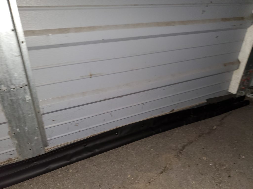 Garage door shown after BottomSealer installed